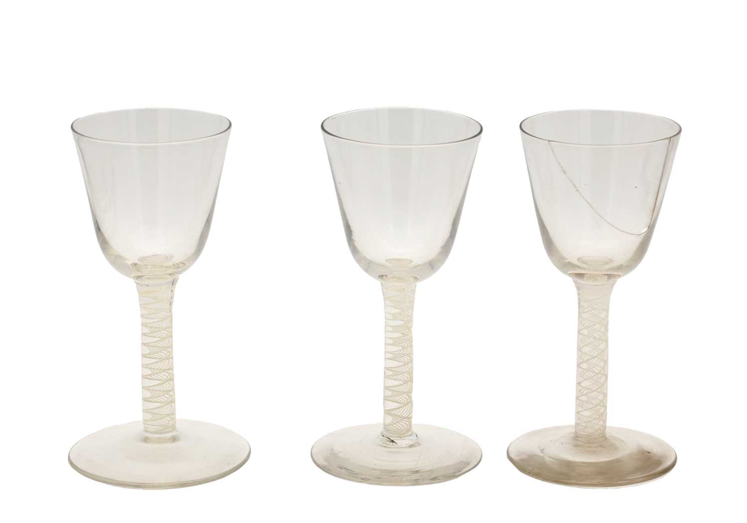 Lot THREE 18TH/19TH CENTURY ENGLISH GLASS WINE GLASSES WITH OPAQUE TWIST STEMS