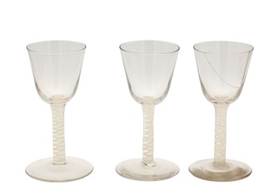 Lot THREE 18TH/19TH CENTURY ENGLISH GLASS WINE GLASSES WITH OPAQUE TWIST STEMS