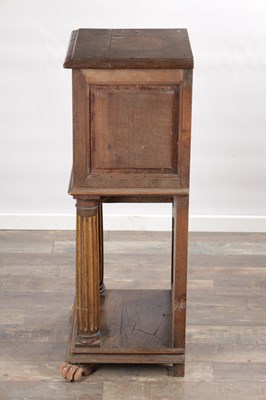 Lot 1524 - A 17TH CENTURY ITALIAN WALNUT AND PARCEL-GILT SIDE CABINET ON STAND