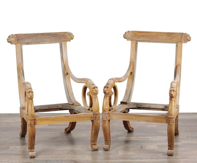 Lot 1700 - A PAIR OF REGENCY STYLE CARVED WOOD LIBRARY ARMCHAIRS