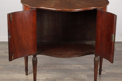 Lot 1602 - A GEORGE III MAHOGANY SERPENTINE SIDE CABINET