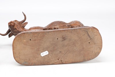 Lot 1427 - IN THE MANNER OF HUGGLER (SWISS 1834-1912) A PAIR OF 19TH CENTURY LINDEN WOOD BLACK FOREST COW AND BULL