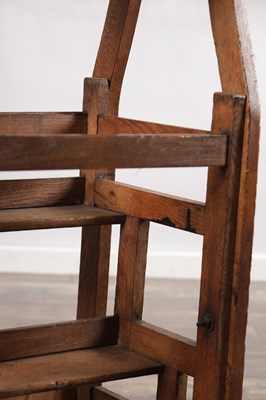 Lot 1581 - A 19TH CENTURY OAK METAMORPHIC STOOL / LIBRARY STEPS