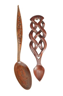 Lot 1422 - TWO CARVED WOODEN SPOONS