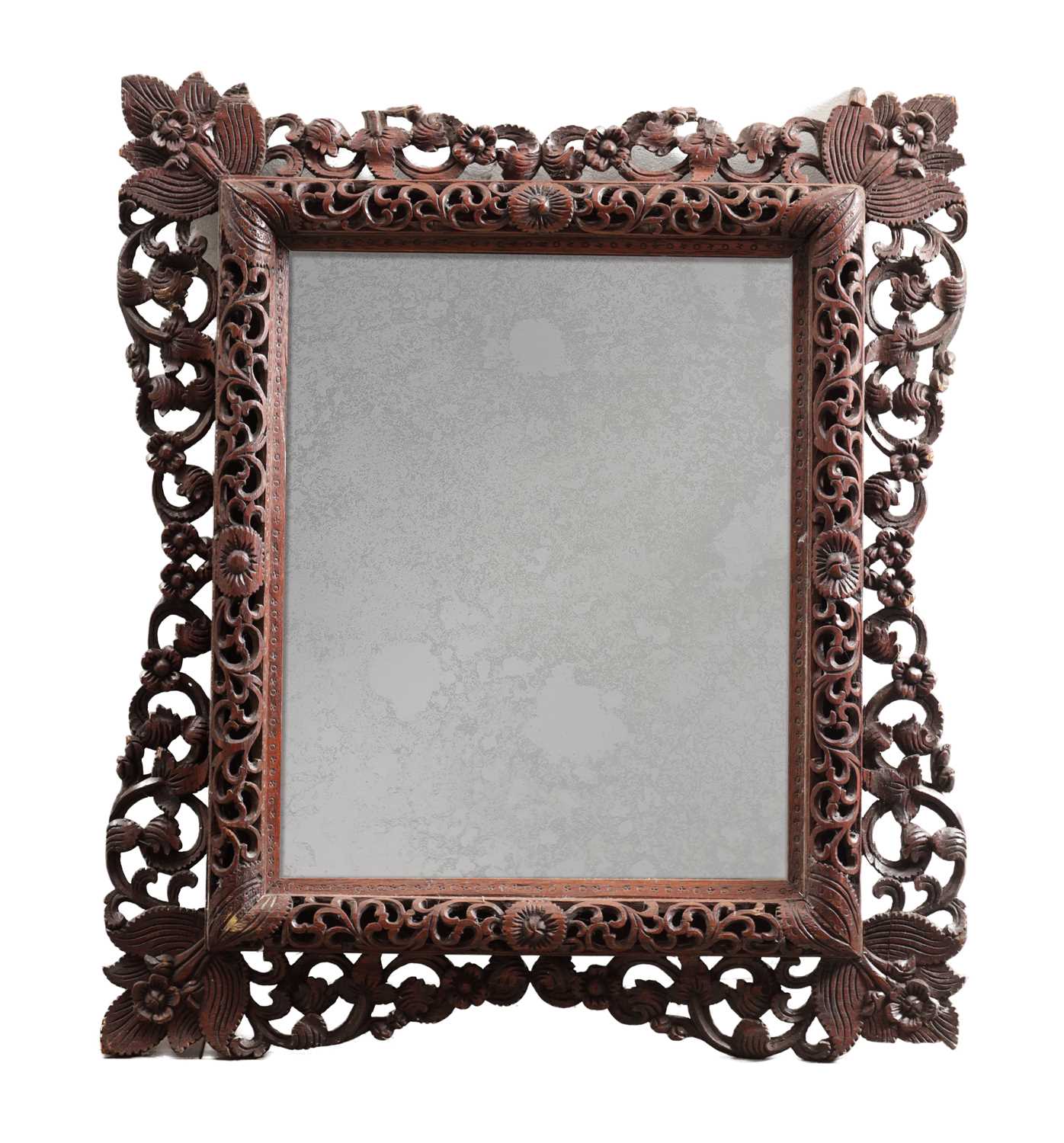 Lot 1547 - A CARVED HARDWOOD MIRROR