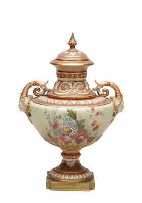 Lot 676 - A LATE 19TH CENTURY ROYAL WORCESTER BLUSH IVORY PORCELAIN TWO-HANDLED PEDESTAL VASE AND COVER