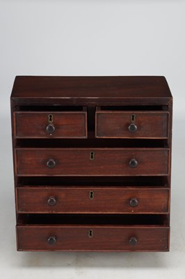 Lot 1597 - A 19TH CENTURY MAHOGANY MINIATURE CHEST OF DRAWERS