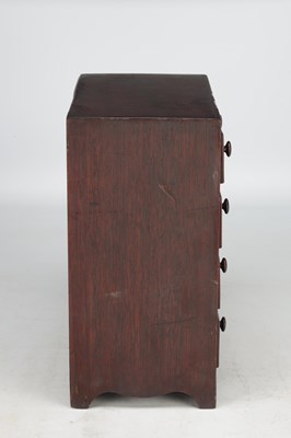 Lot 1597 - A 19TH CENTURY MAHOGANY MINIATURE CHEST OF DRAWERS