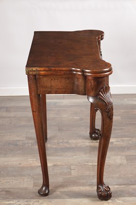 Lot 1689 - A QUEEN ANNE FIGURED WALNUT TEA TABLE