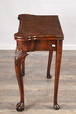Lot 1689 - A QUEEN ANNE FIGURED WALNUT TEA TABLE