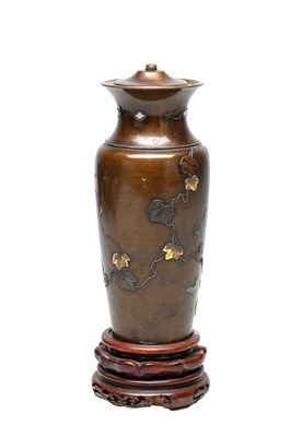 Lot 758 - A MEIJI PERIOD JAPANESE MIXED METAL VASE ON CARVED WOOD STAND