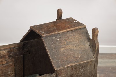 Lot 1527 - A 17TH CENTURY ENGLISH OAK HOODED ROCKING CRADLE