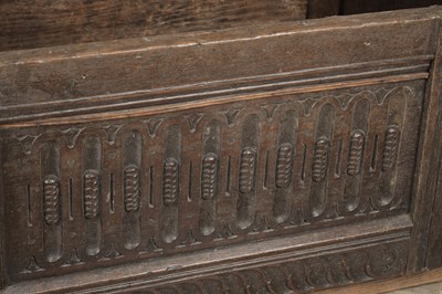 Lot 1527 - A 17TH CENTURY ENGLISH OAK HOODED ROCKING CRADLE