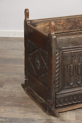 Lot 1527 - A 17TH CENTURY ENGLISH OAK HOODED ROCKING CRADLE