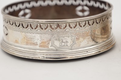 Lot 106 - A PAIR OF GEORGIAN ENGLISH SILVER BOTTLE COASTERS