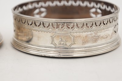 Lot 106 - A PAIR OF GEORGIAN ENGLISH SILVER BOTTLE COASTERS