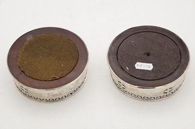 Lot 106 - A PAIR OF GEORGIAN ENGLISH SILVER BOTTLE COASTERS