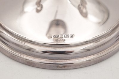 Lot 42 - A COLLECTION OF THREE EARLY 21ST CENTURY ENGLISH SILVER CANDLESTICKS BY CARRS