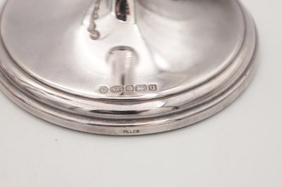 Lot 42 - A COLLECTION OF THREE EARLY 21ST CENTURY ENGLISH SILVER CANDLESTICKS BY CARRS