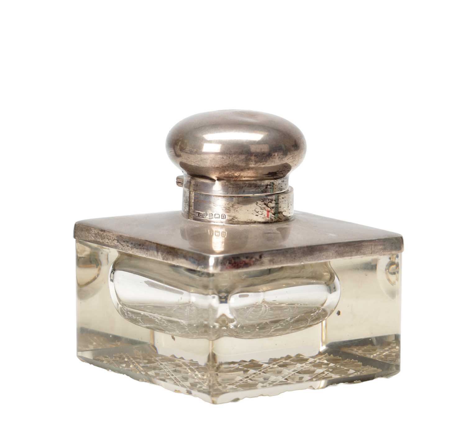 Lot 17 - A 1912 ENGLISH SILVER MOUNTED CUT GLASS INKWELL