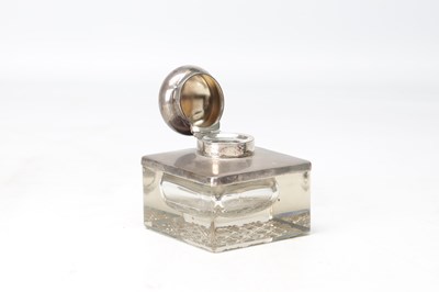 Lot 17 - A 1912 ENGLISH SILVER MOUNTED CUT GLASS INKWELL