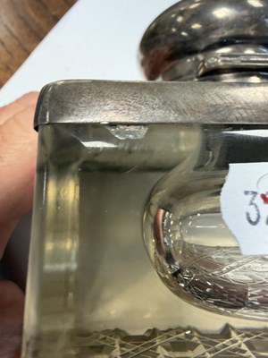 Lot 17 - A 1912 ENGLISH SILVER MOUNTED CUT GLASS INKWELL