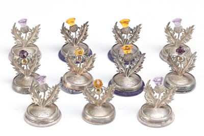 Lot 74 - A SET OF ELEVEN SCOTTISH SILVER THISTLE MENU HOLDERS