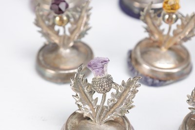 Lot 74 - A SET OF ELEVEN SCOTTISH SILVER THISTLE MENU HOLDERS