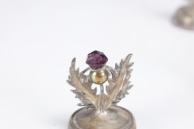 Lot 74 - A SET OF ELEVEN SCOTTISH SILVER THISTLE MENU HOLDERS