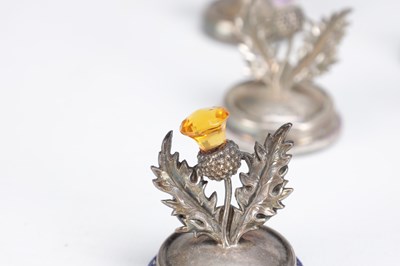 Lot 74 - A SET OF ELEVEN SCOTTISH SILVER THISTLE MENU HOLDERS