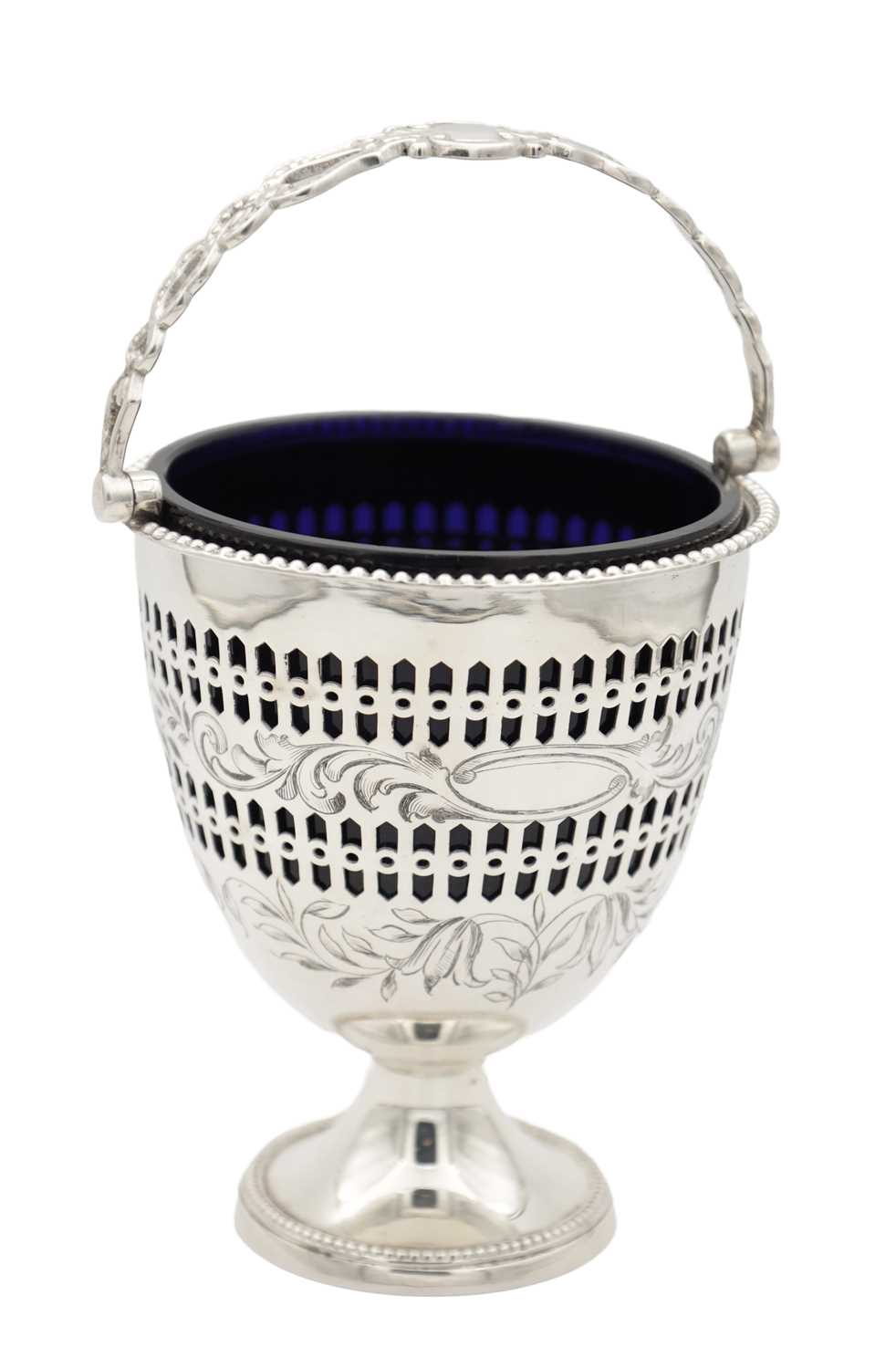 94 - A 19TH/20TH CENTURY SILVER SUGAR BASKET WITH BLUE GLASS LINER