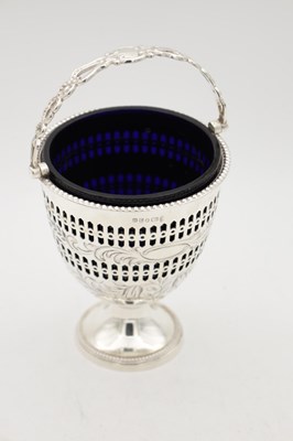Lot 94 - A 19TH/20TH CENTURY SILVER SUGAR BASKET WITH BLUE GLASS LINER