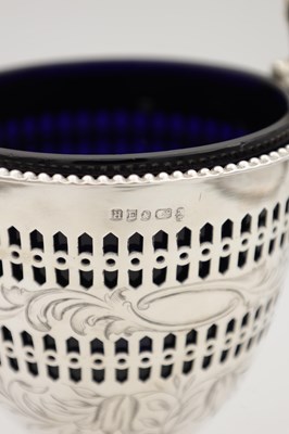 Lot 94 - A 19TH/20TH CENTURY SILVER SUGAR BASKET WITH BLUE GLASS LINER
