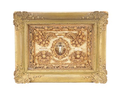 Lot 1060 - A 19TH CENTURY CONTINENTAL BAROQUE-STYLE GILT WIREWORK RELIQUARY IN A GILTWOOD FRAME WITH IVORY CORPUS