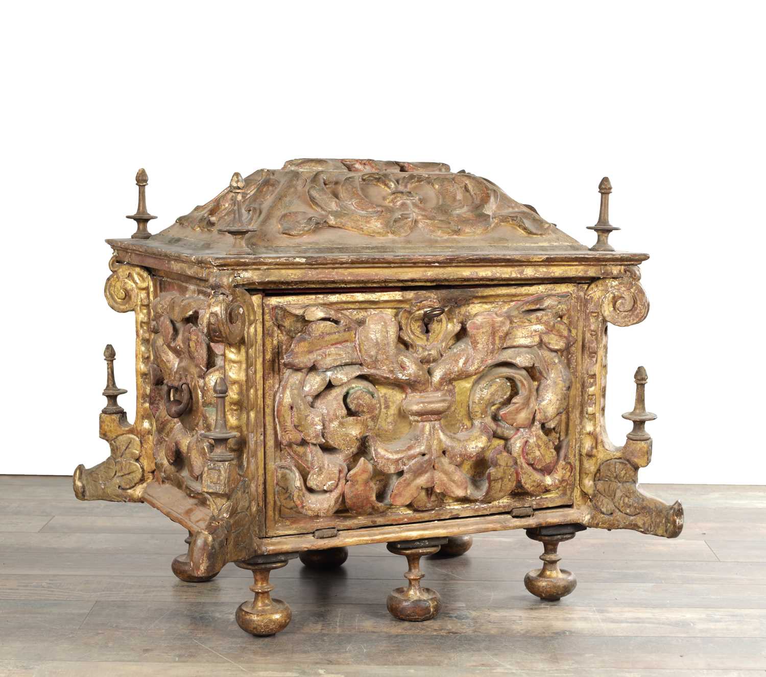 Lot 1528 - AN ITALIAN PARCEL GILT AND POLYCHROME CARVED WOOD CASSONE DOWRY CHEST