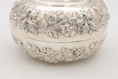Lot 742 - AN EASTERN SILVER REPOUSSE LIDDED DISH
