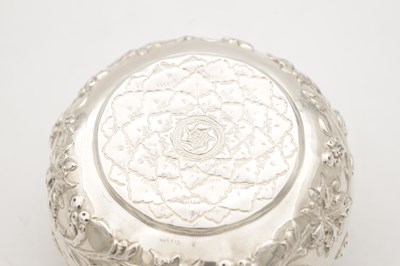 Lot 742 - AN EASTERN SILVER REPOUSSE LIDDED DISH