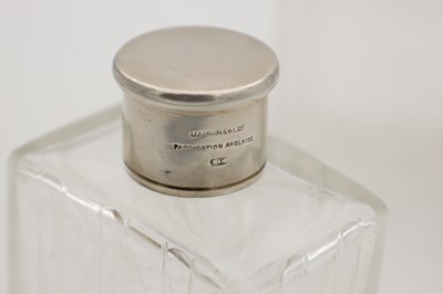 Lot 30 - A COLLECTION OF THREE GLASS SILVER-TOPPED BOTTLES
