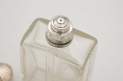 Lot 30 - A COLLECTION OF THREE GLASS SILVER-TOPPED BOTTLES