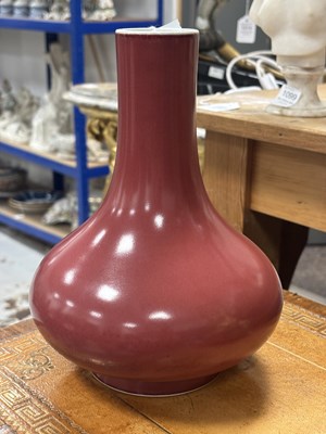 Lot 797 - A CHINESE SANG-DE-BOEUF GLAZED PORCELAIN BOTTLE VASE