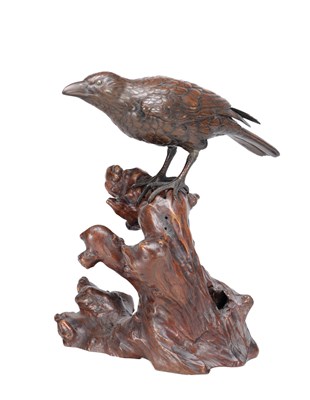 Lot 819 - A MEIJI PERIOD JAPANESE BRONZE MODEL OF A CROW ON A CARVED ROOT WOOD STAND