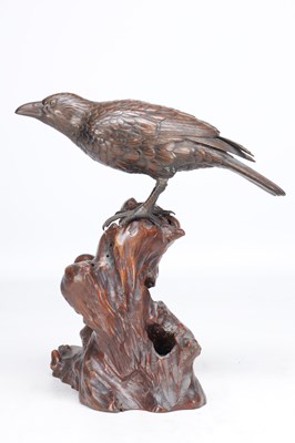 Lot 819 - A MEIJI PERIOD JAPANESE BRONZE MODEL OF A CROW ON A CARVED ROOT WOOD STAND