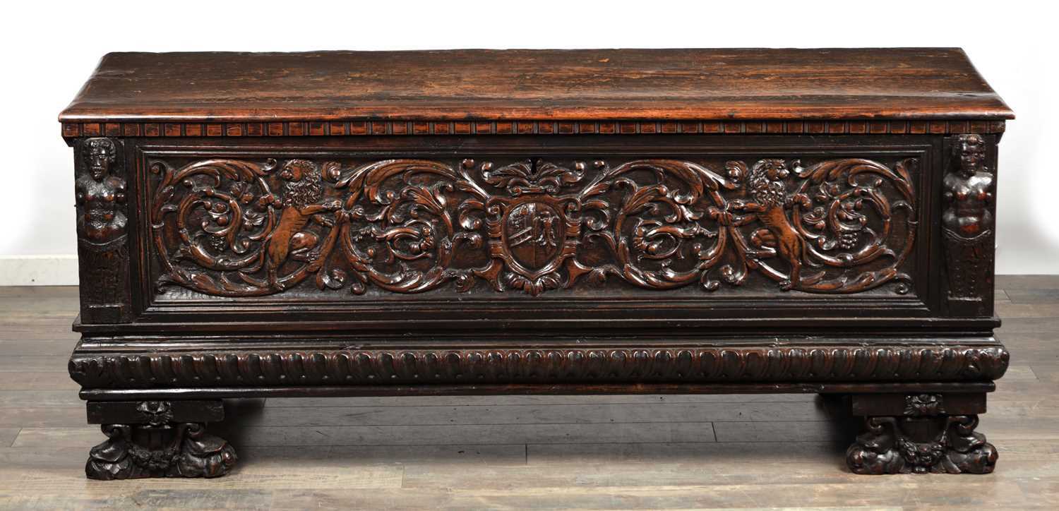 Lot 1562 - A 17TH CENTURY ITALIAN CARVED WALNUT CASSONE