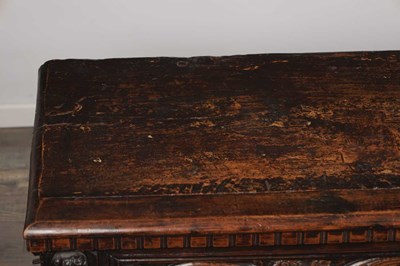 Lot 1562 - A 17TH CENTURY ITALIAN CARVED WALNUT CASSONE