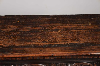 Lot 1562 - A 17TH CENTURY ITALIAN CARVED WALNUT CASSONE