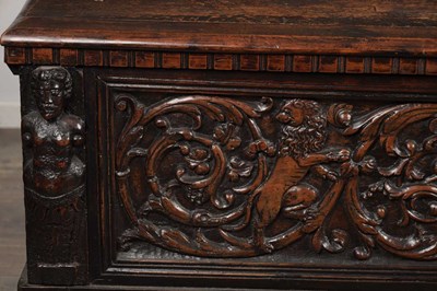 Lot 1562 - A 17TH CENTURY ITALIAN CARVED WALNUT CASSONE