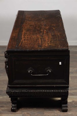 Lot 1562 - A 17TH CENTURY ITALIAN CARVED WALNUT CASSONE