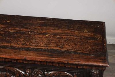 Lot 1562 - A 17TH CENTURY ITALIAN CARVED WALNUT CASSONE