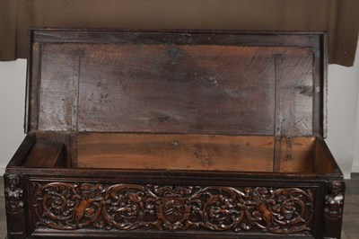 Lot 1562 - A 17TH CENTURY ITALIAN CARVED WALNUT CASSONE