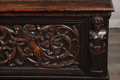 Lot 1562 - A 17TH CENTURY ITALIAN CARVED WALNUT CASSONE